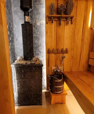 Фото Печь для русской бани Анапа в трёхстороннем кожухе (пироксенит) с открытым верхом в магазине Woodson